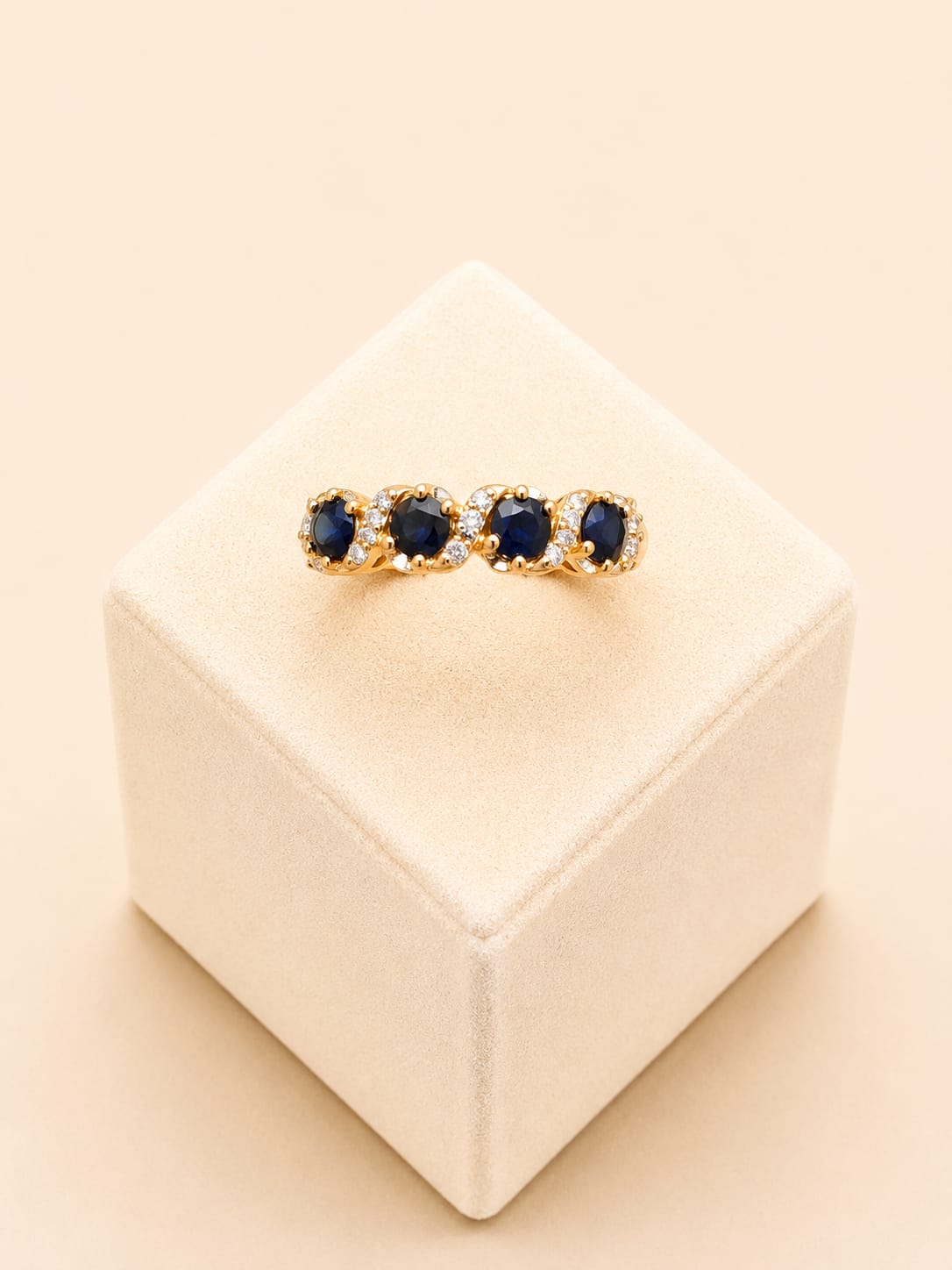 22ct Gold Ring with Oval Blue Stone and Clear Stone Clusters