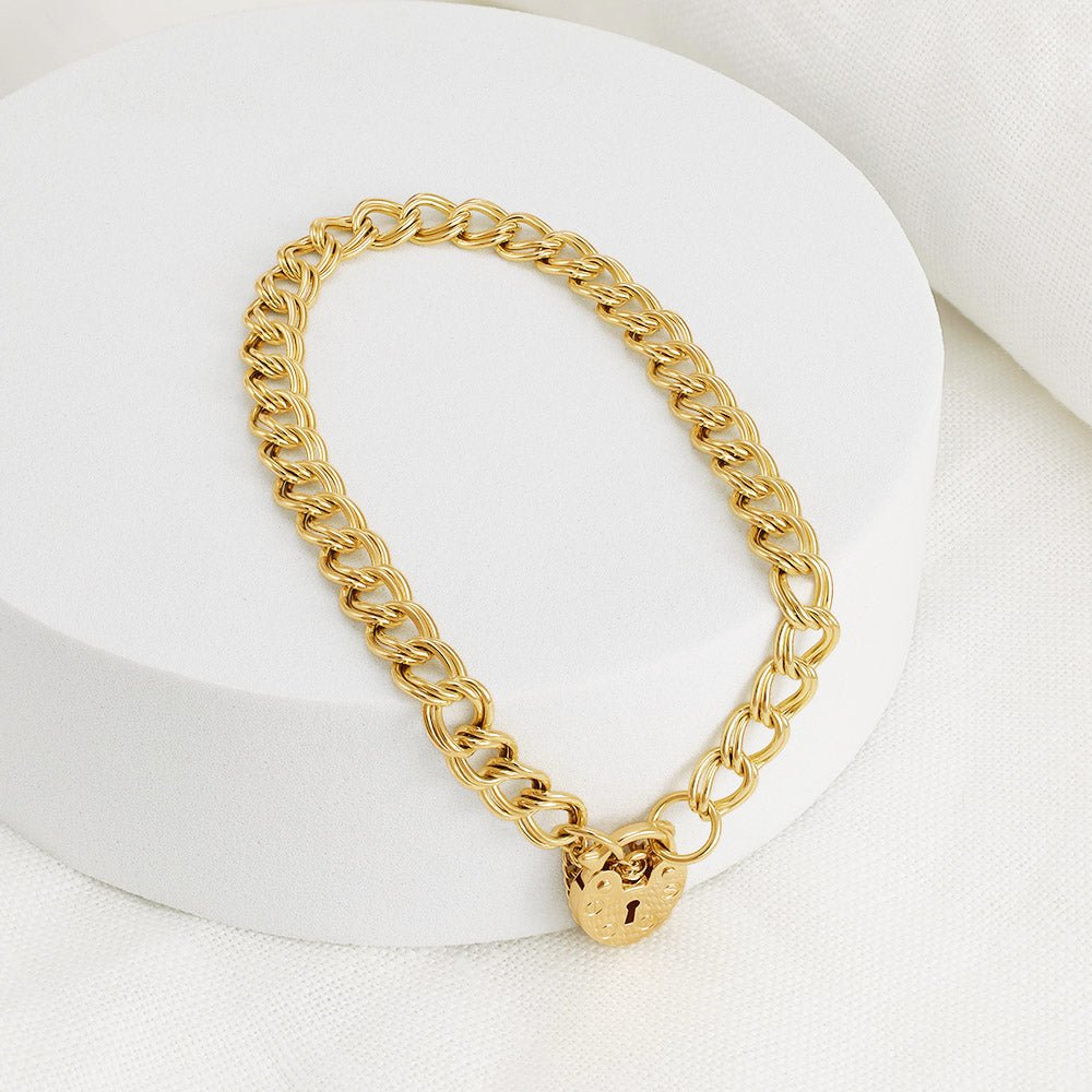 9ct gold double curb link bracelet with a heart shape padlock charm - FJewellery