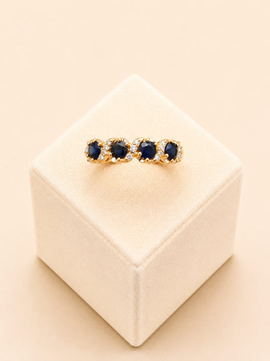 22ct Gold Ring with Oval Blue Stone and Clear Stone Clusters