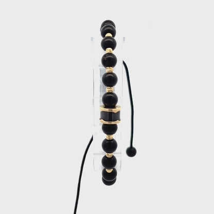 14ct yellow gold pre-owned bracelet with black beads FCA06010741-3